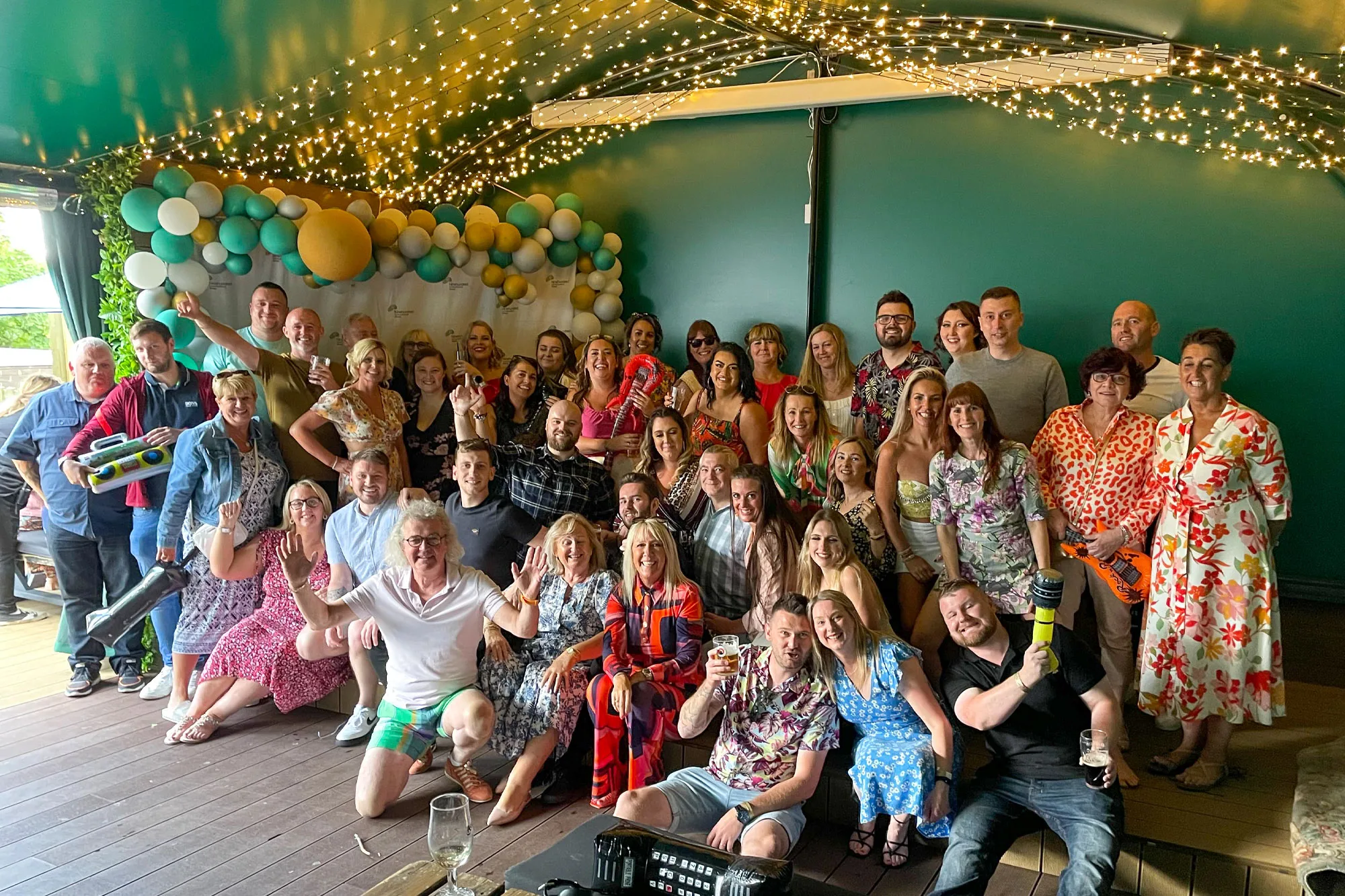 picture of all ninehundred staff celebrating