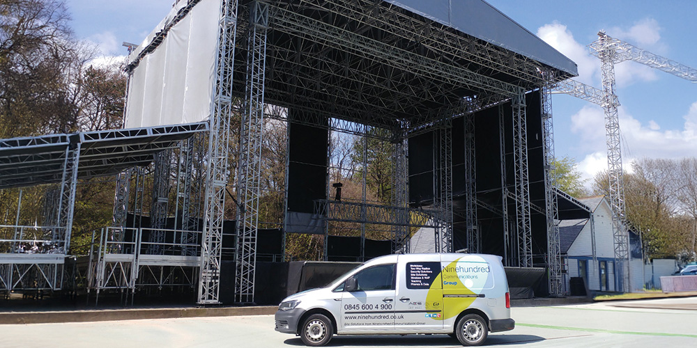a van parked under a stage