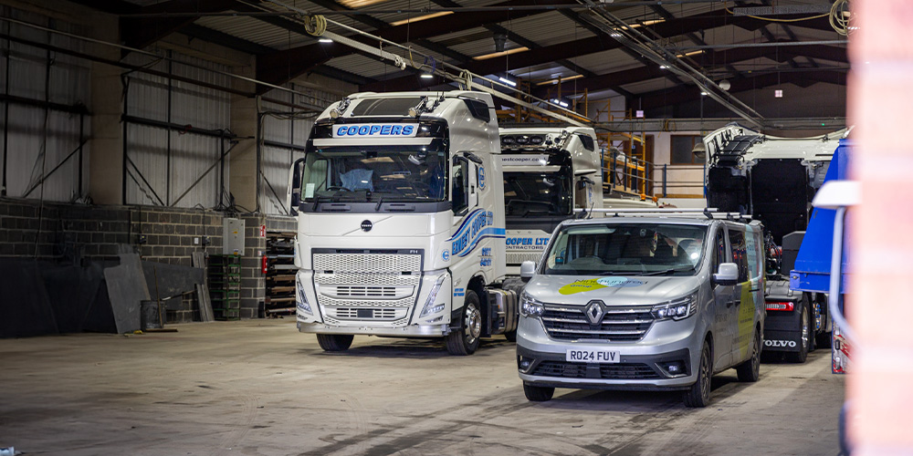 Trucks parked inside a warehouse.