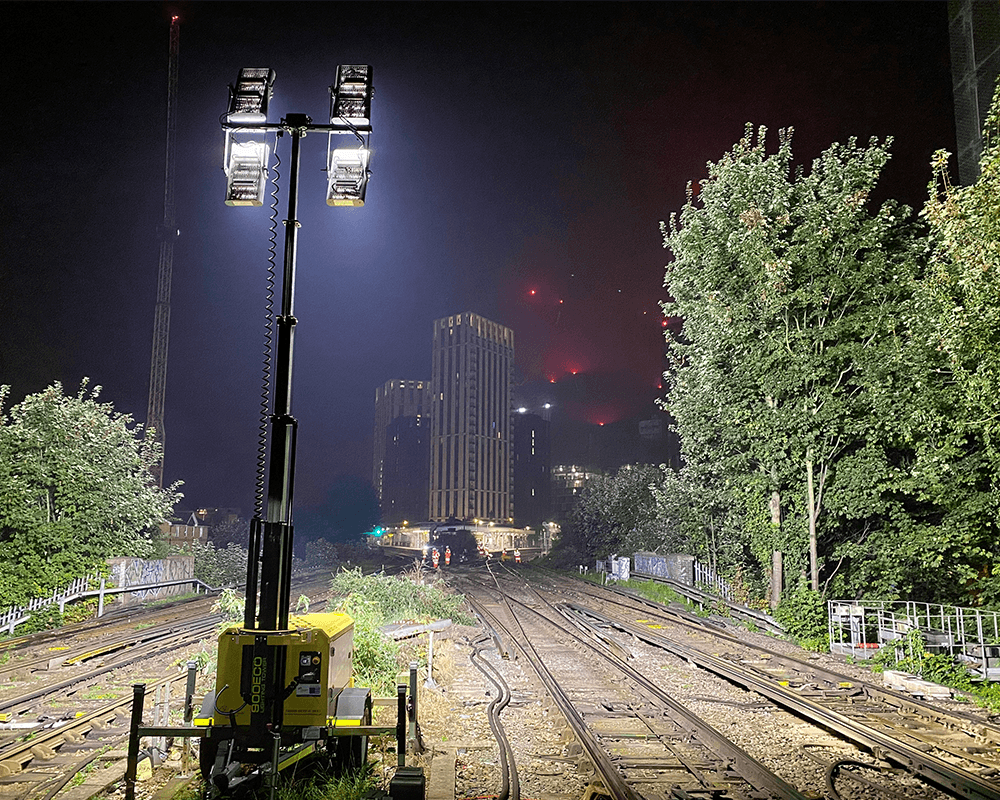 Illuminated railway tracks at night