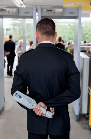 handheld metal detector in hand