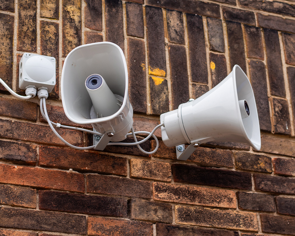 Two tannoy speakers in a playground