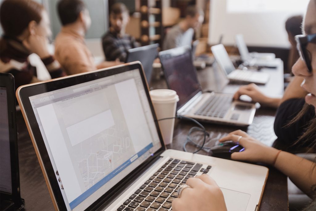 loads of people on laptops in an office