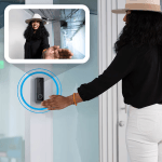 a woman wearing a hat and touching a video call