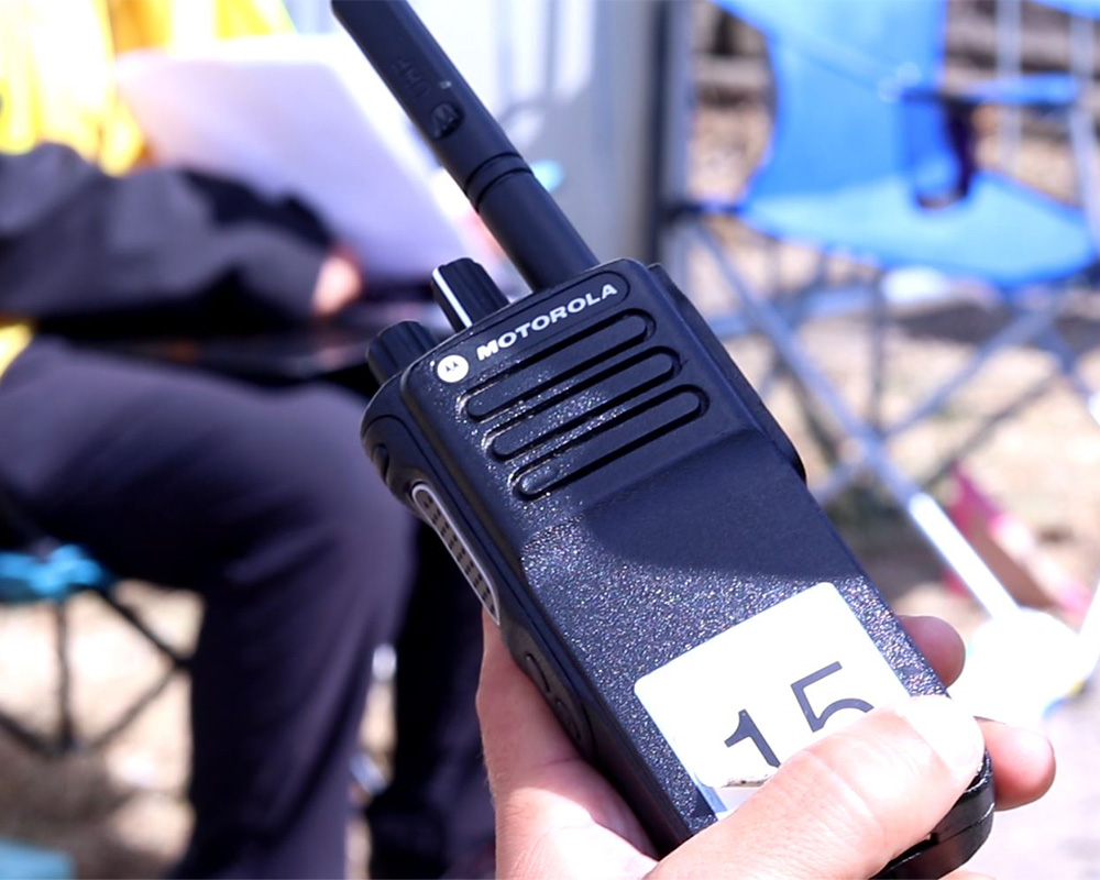 a person holding a walkie talkie